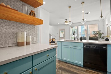 Kitchen with dishwasher, a sink, recessed lightin