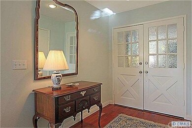 Double door entry with gleaming Brazilian Cherry w