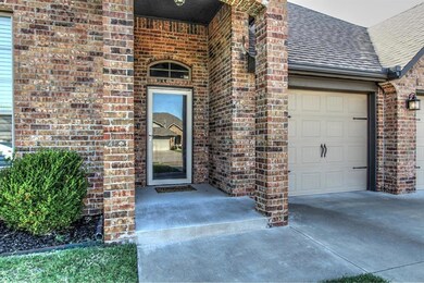 Doorway to property featuring a garage
