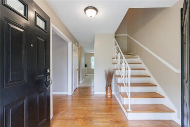 Foyer featuring baseboards, light wood-style floor