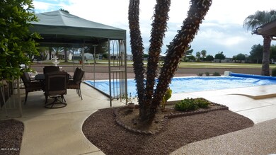View of pool, gazebos, golf course