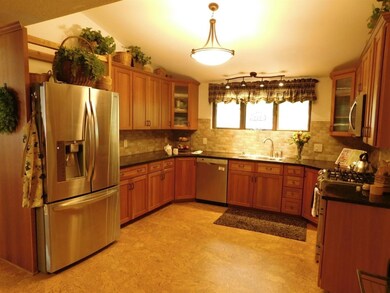 Updated kitchen with stainless appliances, tile ba