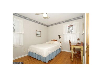 12'x9.5' back corner master bedroom with oak hardw