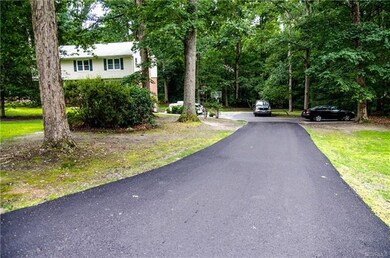 Paved driveway with extra parking areas