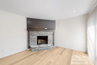 Unfurnished living room with baseboards, recessed 