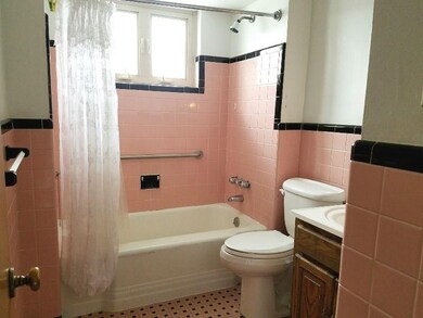 Hall bath, ceramic tile walls/flooring, vanity sin