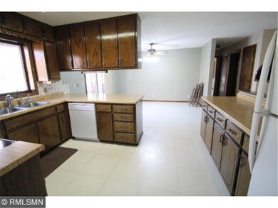 Kitchen is open to informal dining area.