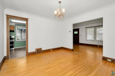 Spare room featuring light wood-type flooring, cro