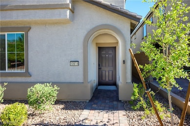 Doorway to property featuring stucco siding