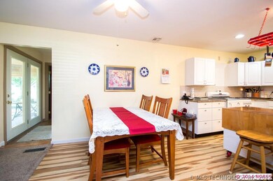 Kitchen updated with new flooring, cabinets, grani