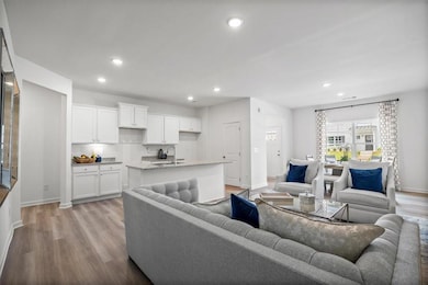 Living area featuring recessed lighting and light wood-type flooring