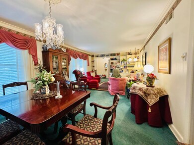 Dining area with carpet flooring, an inviting chan
