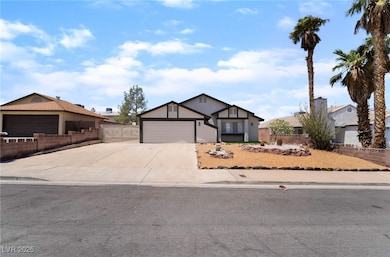 View of front facade with concrete driveway, an at