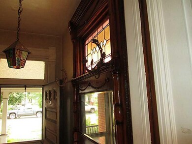 Entry/Foyer. Gorgeous stained glass and original c