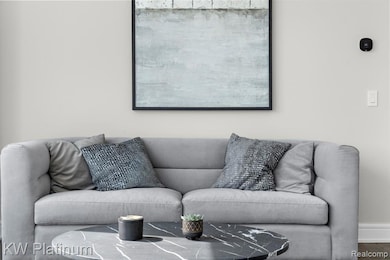 Living area featuring baseboards