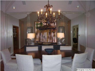 Dining room. Foyer to right. Den with wet bar to l