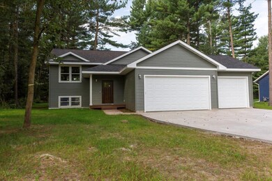 Side view & great three car garage