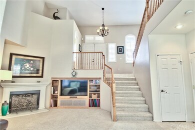 Family Room view of Entertainment Center and Stair
