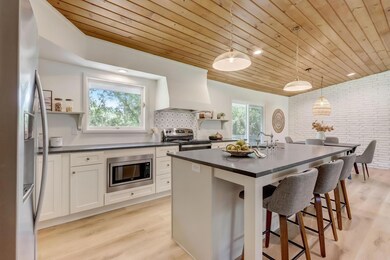 Wonderful updates include brand-new roof, gutters, drain tile, HVAC system, freshly painted interior, brand-new light fixtures + so much more - this home was touched from top to bottom!