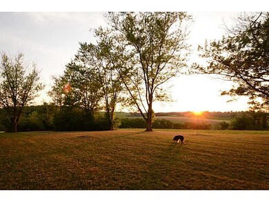 Land. The sun sets in the back...