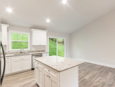 Kitchen with sink, light hardwood / wood-style flo