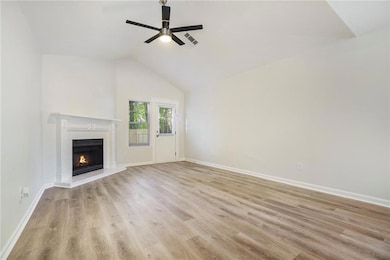 Unfurnished living room featuring visible vents, a