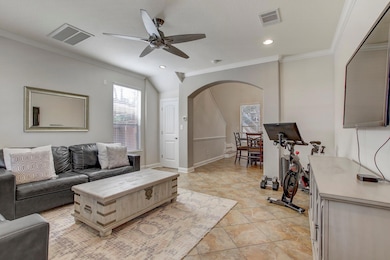 Living area with arched walkways, visible vents, 