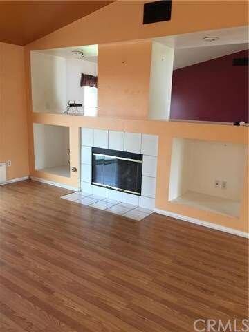Fireplace in family room, open to kitchen