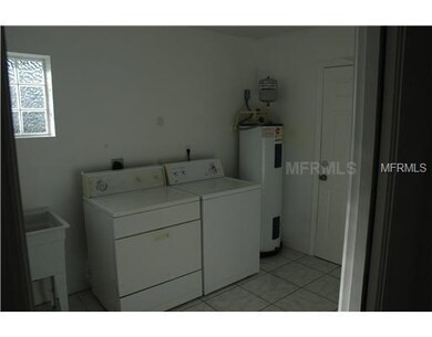 Laundry Room - Large laundry room, with utility sink, counter and shelves