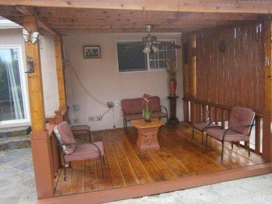 Custom patio with wood floor, fan electrical  