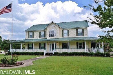 The porch wraps around sides and rear to where the