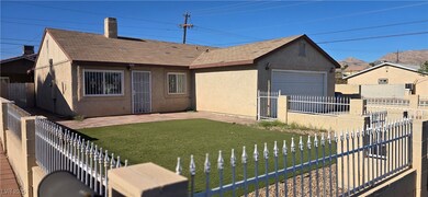 View of front of property with stucco siding, a sh