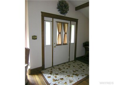 Foyer Foyer with ceramic tile and cathedral open b