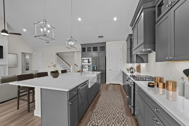 Kitchen with vast island & upper glass shelves