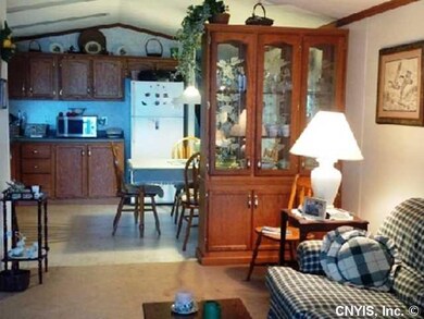 Library. Living room looking toward the kitchen an