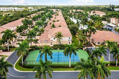Aerial perspective of suburban area featuring a large body of water