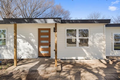 Property entrance featuring a patio area