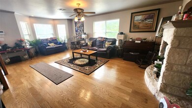 Living area featuring ornamental molding, a ceili