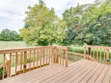 Spacious deck overlooks your 1.88 acre yard