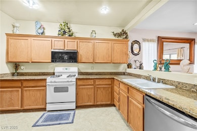 Kitchen with stainless steel appliances, a sink, a