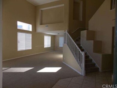 Tile entry, formal living with vaulted ceilings an