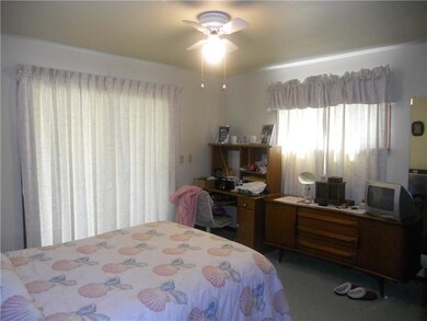 master bedroom with sliders out to front deck