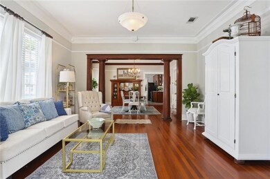 Columned cased opening divides living/dining rooms