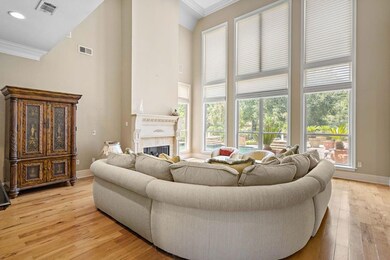 Wall of windows and soaring ceilings grace this ma