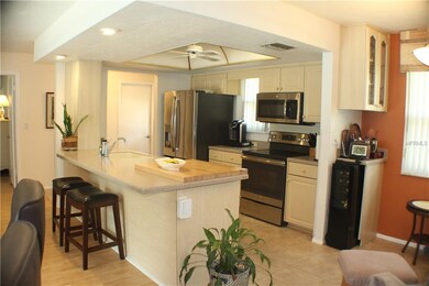 Kitchen with stainless steel appliances, corian co