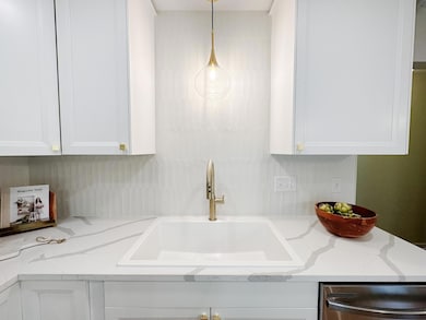 Close up of sink, faucet, backsplash, and countertops!