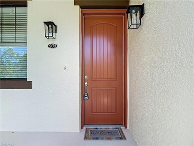 Doorway to property with stucco siding