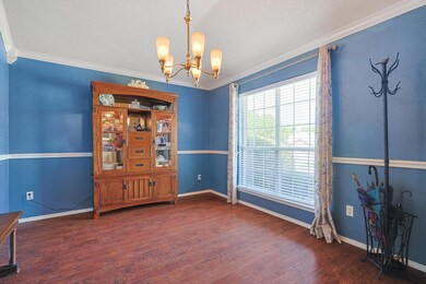 Dining room to the right of entry with crown moulding