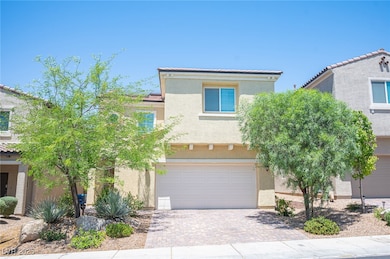 View of front of house featuring stucco siding, a