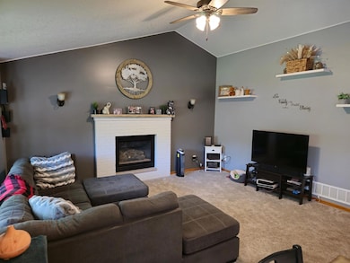 Keep warm near the gas fireplace in this upper level living room.